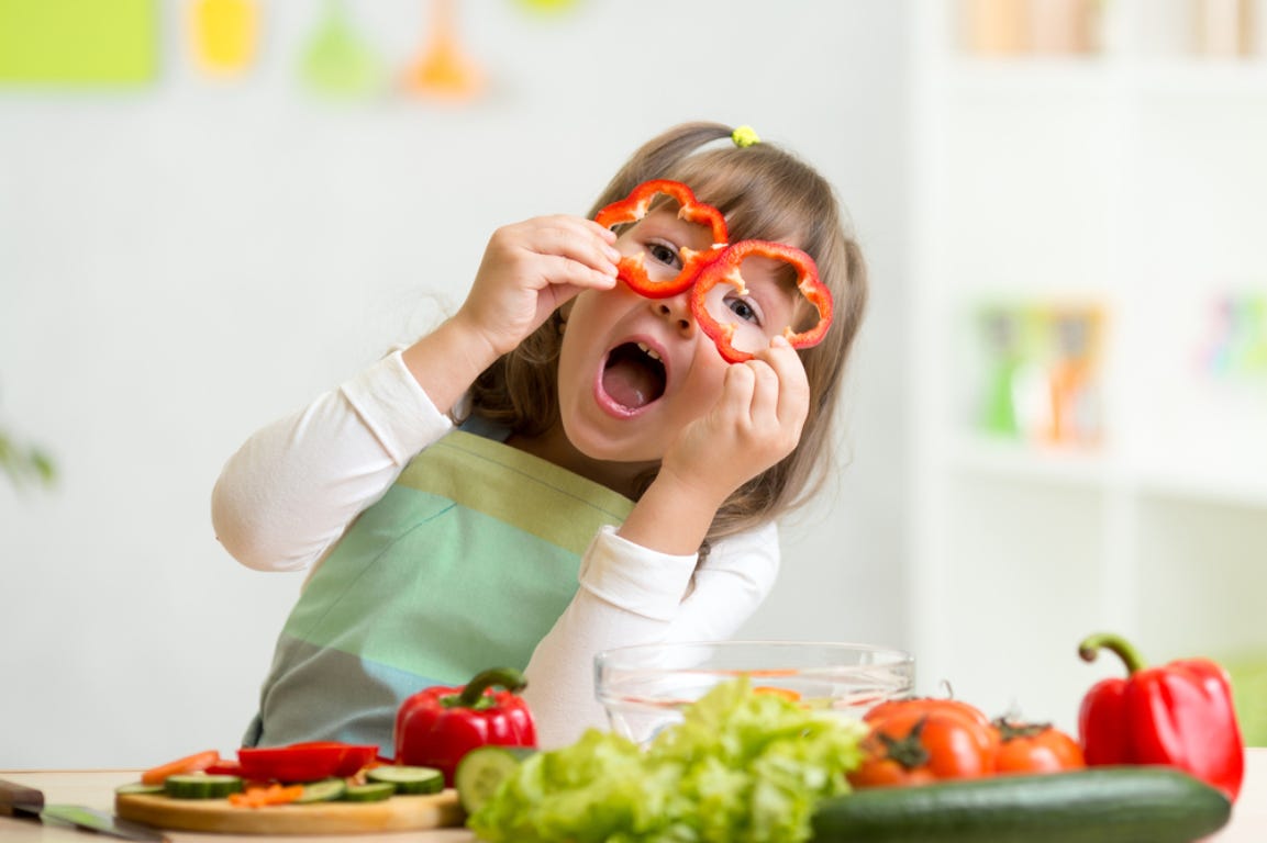 Kids growing their own vegetables in the garden