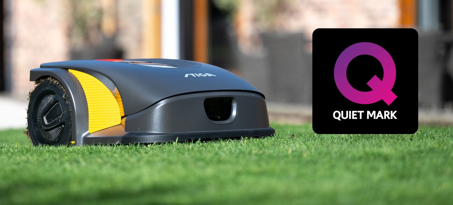 stiga grey robot mower on lawn